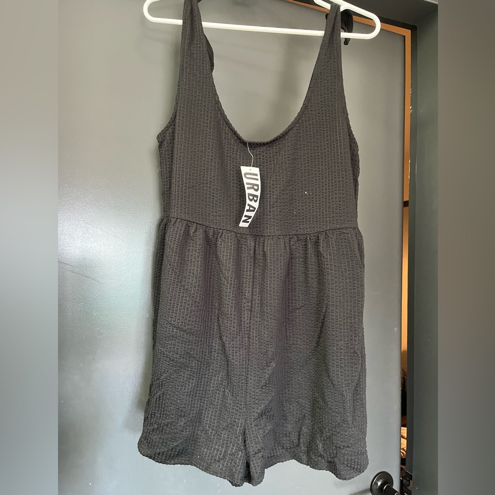 L Urban Outfitters black textured romper. New with tags, never worn